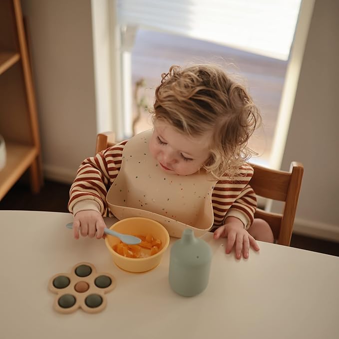 mushie Silicone Baby Bib | Adjustable Fit Waterproof Bibs (Vanilla Confetti)