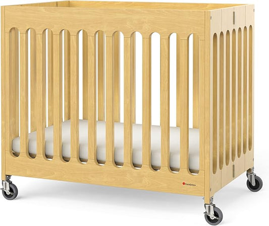 Foundations Boutique Folding Mini Baby Crib - Compact, Portable, Wooden Hotel Crib, Foldable Mini Cribs for Baby & Toddlers - Includes 3" Foam Mattress - Natural