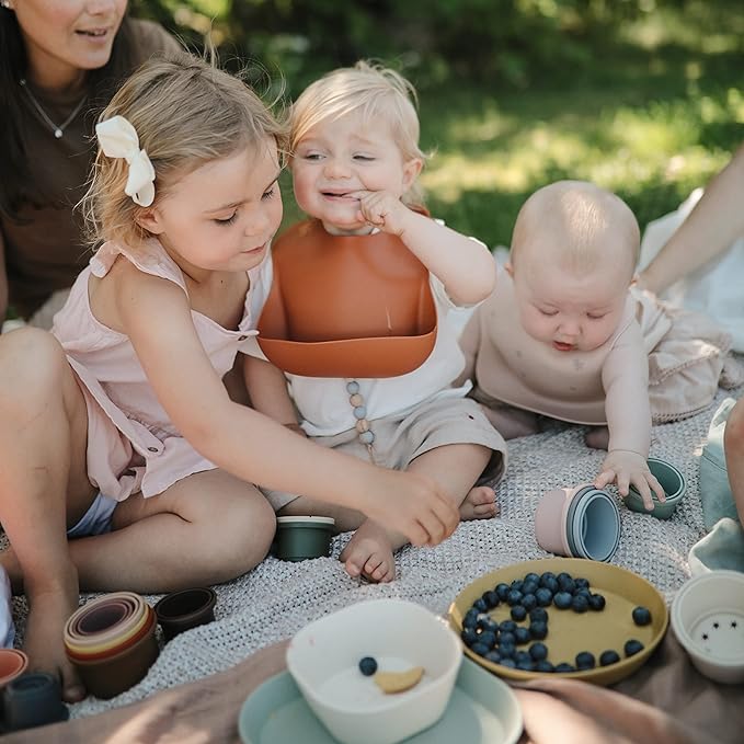 mushie Silicone Baby Bib | Adjustable Fit Waterproof Bibs (Vanilla Confetti)